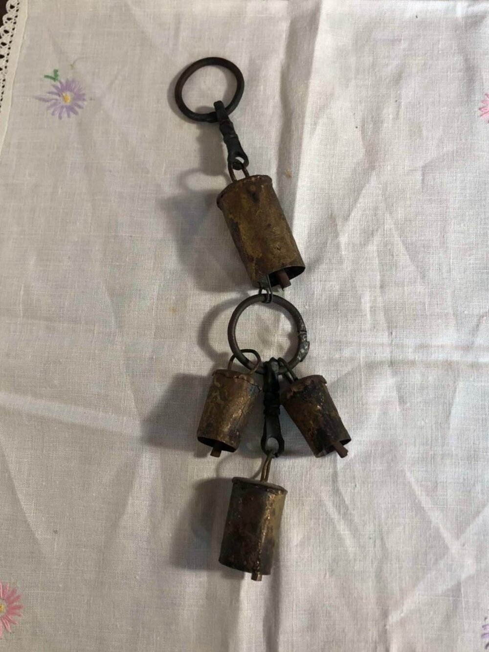 Hanging cow bells wall art